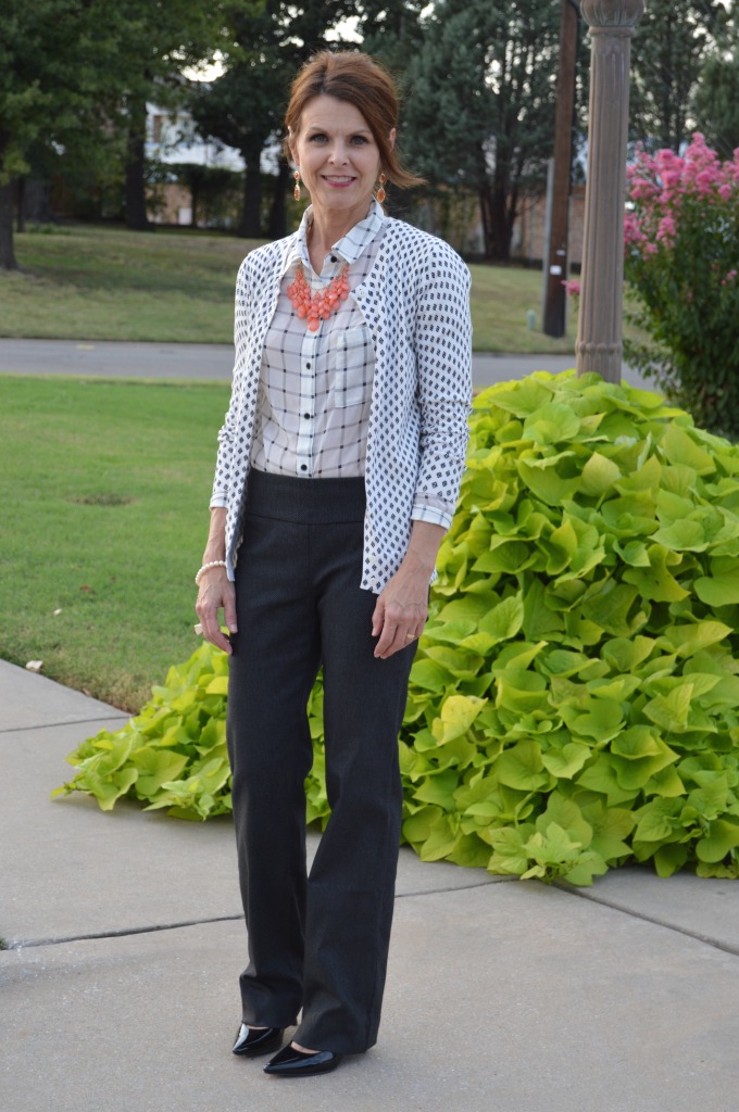 Black/grey pants, windowpane blouse with print sweater + heels & a statement necklace